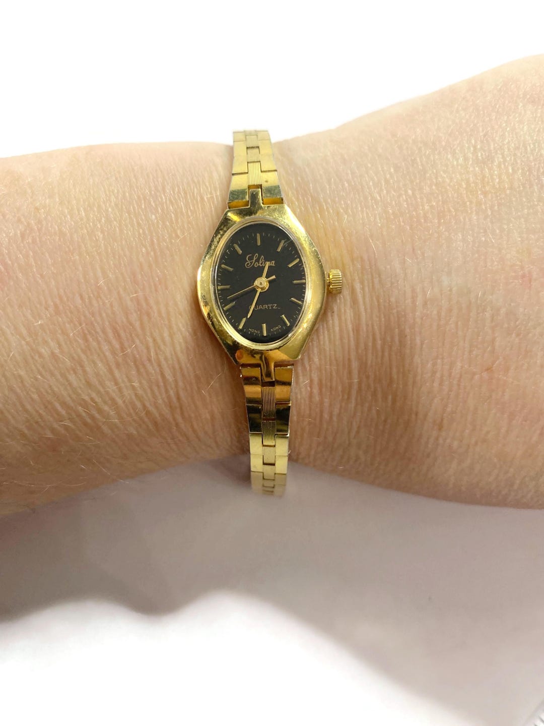 Vintage SOLINA Gold Tone Oval Black Face Ladies Analog Wrist Watch