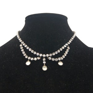 Vintage Art Deco Style Silver Tone and Clear Rhinestones 16 Inch Bib Necklace with Slide Lock Clasp.