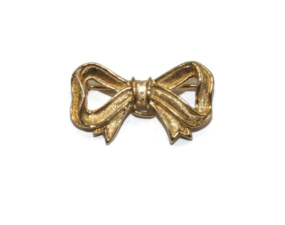 Small Vintage Avon Gold Tone Bow Brooch. Avon Hal… - image 1