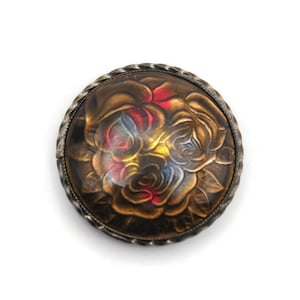 Vintage Round Metal Colored Enamel with Clear Top Coat Floral Design Dress Clip.