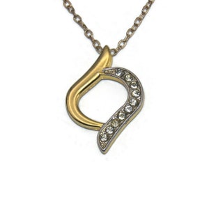 Vintage Gold Tone and Clear Rhinestones Pendant on 18 Inch Gold Tone Chain with Lobster Claw Clasp.