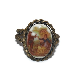 Vintage Gold Tone and Ceramic Size 7 Open Cuff Ring with Courting Couple Applique. Victorian Style Design.