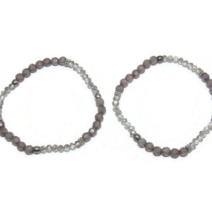 Pair of Vintage Silver Tone, Clear and Gray Beaded 7 Inch Elastic Bracelets.
