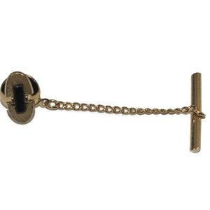 Vintage Swank Textured Gold Tone and Black Plastic Oval Tie Tack with Chain. Swank Hallmark.