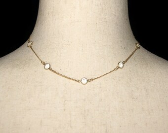 Gorgeous Vintage Gold Tone and Bevel Set Clear Crystals 15 Inch Necklace with a Spring Ring Clasp.