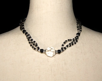 Vintage Silver Tone, Clear and Black Glass and Clear Plastic 18 Inch Beaded Necklace with a Hook Clasp.