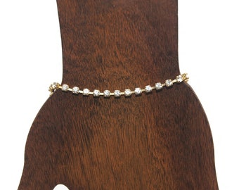 Vintage Gold Tone and Clear Rhinestones 7 Inch Tennis Bracelet with Slide Lock Clasp.