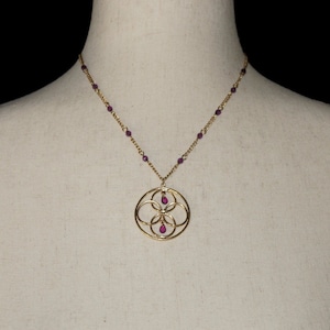 Vintage Avon Gold Tone and Faux Amethyst Beads Circle Pendant on 17 Inch Chain with Lobster Claw Clasp. Avon Hallmark Tag.