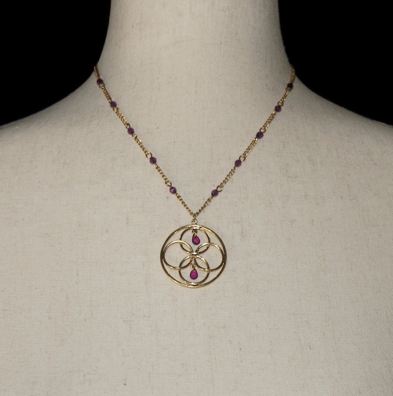 Vintage Avon Gold Tone and Faux Amethyst Beads Circle Pendant on 17 Inch Chain with Lobster Claw Clasp. Avon Hallmark Tag.