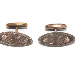 Antique Gold Tone Oval Cuff Links with Etched Design.