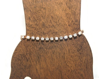 Vintage Gold Tone and Rhinestones 7 1/2 Inch Tennis Bracelet with Lobster Claw Clasp.