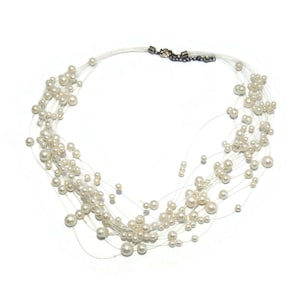 Vintage 19 Inch Multi Strand Stationary Faux Pearl Necklace with Lobster Claw Clasp.