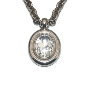 Vintage Givenchy Silver Tone and Large Rhinestone Oval Pendant on Heavy 36 Inch Silver Tone Chain with Toggle Clasp. Givenchy Hallmark.