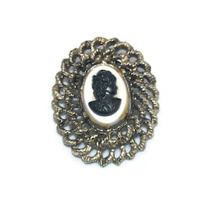 Vintage Gold Tone with Black and White Resin Oval Cameo Brooch.