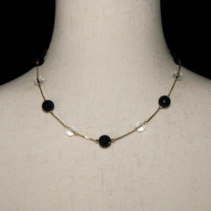 Vintage 1990s Trifari Gold Tone, Clear and Black Glass 17 1/2 Inch Beaded Necklace with Spring Ring Clasp and Trifari Hallmark.