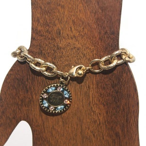 Avon PC President&#39;s Club Award Gold Tone Chain Bracelet with Round Charm Marked PC 2003 with Blue and Pink Rhinestones. Avon Hallmark.