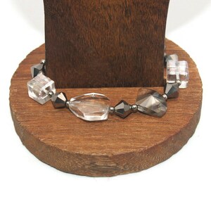 Vintage 7 Inch Elastic Stretch Bracelet with Gray and Clear Glass Beads.