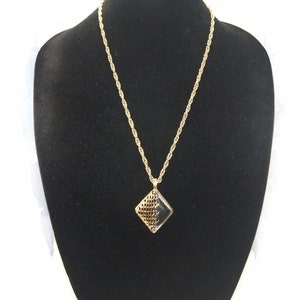 Vintage Gold and Silver Tone Diamond Shape Pendant on 24 Inch Gold Tone Chain with Spring Ring Clasp.