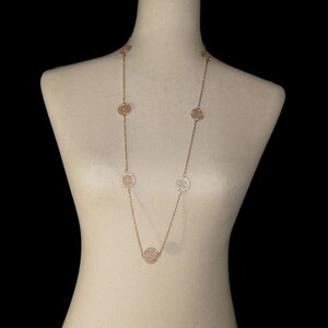 Vintage Gold Tone and Clear Rhinestones 34 Inch Necklace with Lobster Claw Clasp.