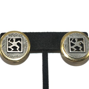 Vintage Gold Tone and Pewter Round Clip on Earrings with Cut Out Design.