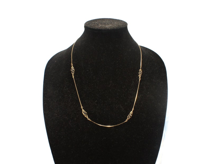 Vintage Gold Tone and Caged Black Beads 24 Inch Necklace with Spring Ring Clasp.