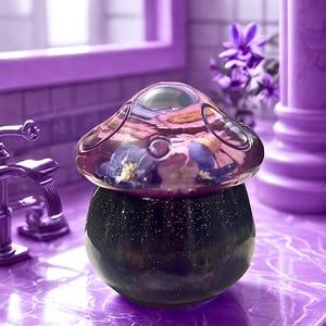 May include: A set of three ceramic mugs with a speckled, matte finish. The mugs are in shades of cream, light gray, and dark gray. Each mug has a simple, minimalist design, perfect for coffee or tea.