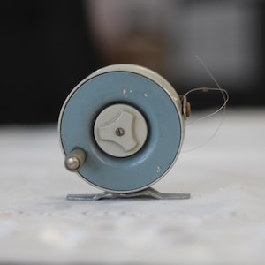 Vintage Metal Fishing Reel: Retro 1960s Fishing Decor