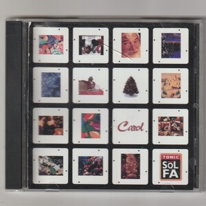 May include: A CD case featuring a grid of Christmas-themed images, including a Christmas tree, Santa Claus, and festive decorations. The word "Carol" is printed in red, and the lower right corner has the text "TONIC SOL FA".