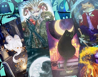 May include: A set of tarot cards featuring various illustrations, including a black cat, a ghost, a horned creature, and a frog. The cards have a dark and whimsical aesthetic.