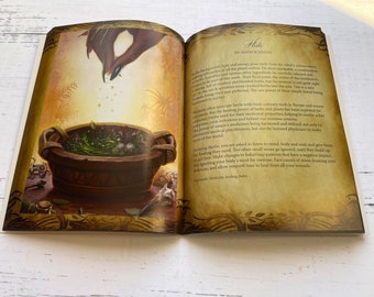 May include: Open book with a yellowed page showing an illustration of a hand sprinkling herbs into a bowl. The text on the page reads "Herbs by Adam Scaimide".