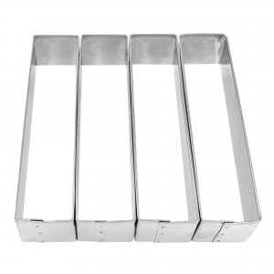 May include: Set of four stainless steel rectangular cake rings. The rings are about 8 inches long and 3 inches wide.