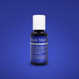 May include: A small bottle of royal blue food coloring. The bottle is labeled "Royal Blue" and has a white cap.