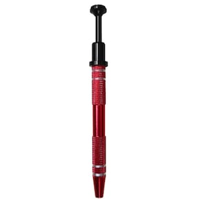 May include: A red and black precision tool with a textured grip. The tool has a black top and a red body with a textured pattern. The tool is designed for precision work and has a pointed tip.