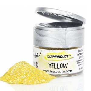 May include: A small silver jar with a yellow lid containing yellow edible glitter. The jar is labeled "DIAMONDUST™ YELLOW" and "WWW.THESUGARART.COM".