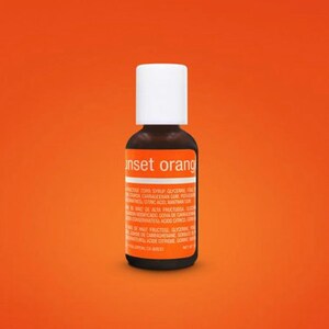 May include: A small brown glass bottle with a white cap. The bottle is labeled "Inset orang" and contains a liquid. The label also includes a list of ingredients.