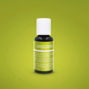 May include: A small bottle of avocado-flavored extract. The bottle is clear glass with a white cap and a green label that says "avocado".
