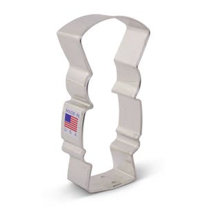 May include: A silver metal cookie cutter shaped like a tall, slender,  Christmas stocking. The cutter has a smooth, shiny finish and is made in the USA.