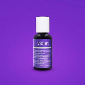 May include: A small bottle of violet food coloring. The bottle is white with a black label that says "violet".