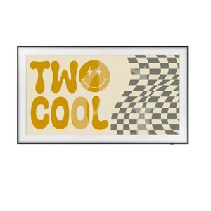 May include: A framed print with a yellow background and the text "TWO COOL" in a retro font. A yellow smiley face with lightning bolts is above the text. A black and white checkered pattern is on the right side of the print.
