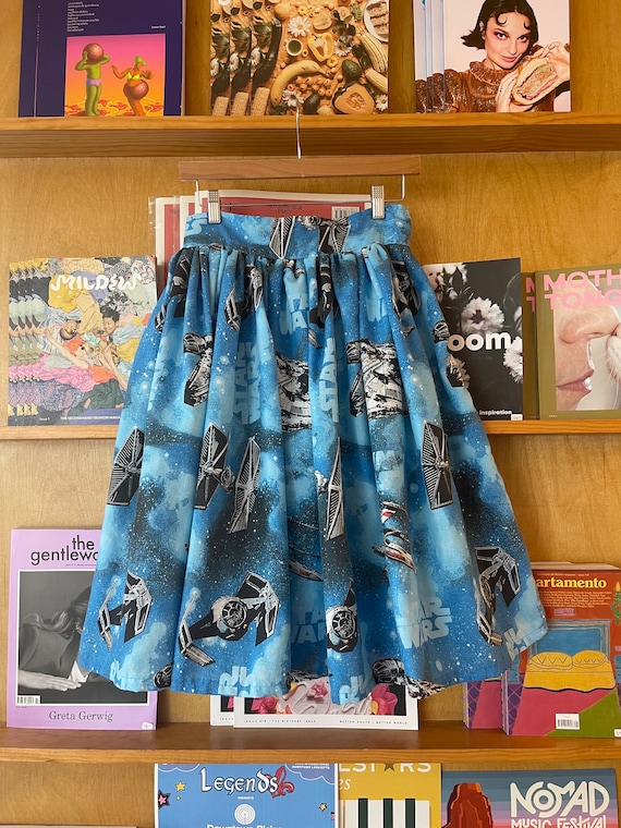 A handmade flared skirt sewn from actual vintage Star Wars fabric featuring the Millennium Falcon — wearable nostalgia that's genuinely one-of-a-kind.