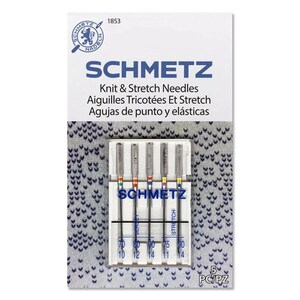 May include: A package of 5 Schmetz knit and stretch needles in a clear plastic case. The needles are labeled with sizes 70, 80, 90, 75, and 80. The package also includes the text "5 PC/PZ".