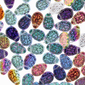 May include: Assortment of iridescent glass beads in various colours, shaped like eggs with a textured surface. The beads have a hole at the top for stringing.