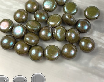 May include: A pile of 18 round, iridescent green glass beads. The beads have a slightly textured surface and a subtle shimmer. The beads are approximately 6mm in diameter.