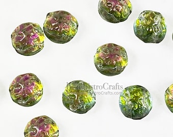 May include: Artisan glass beads with a textured, organic look. The beads are a mix of green, yellow, and purple, with a metallic sheen. The beads are round and slightly flattened. The image includes the text beadbistroCrafts.com.