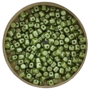 May include: A container of small, round, green beads with a hole in the center. The beads have a matte finish.