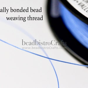 May include: A spool of blue thermally bonded bead weaving thread. The thread is thin and translucent, and the spool is black with white text that reads "For Adult Use Only, Valley Twp., PA".