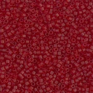 May include: A close-up shot of numerous small, cylindrical, red beads. The beads are densely packed together, creating a textured surface. The color is a deep, rich red, and the beads appear to be made of plastic or glass, suitable for jewelry making or crafts.