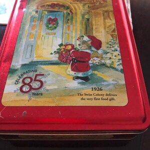 Vintage Tin Christmas Swiss colony slight dent but clean inside no rust