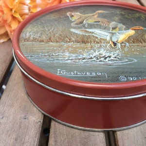 Vintage round metal  tin Gustaveson