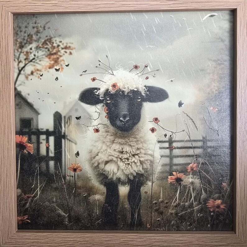 May include: A white sheep with a black face and a crown of orange flowers stands in a field of tall grass. The sheep is looking at the camera. The background is a blurry image of a wooden fence and a field.